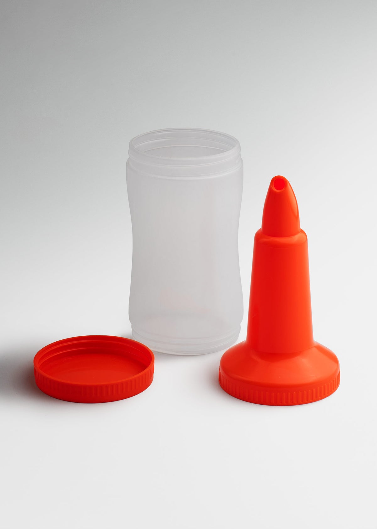 Botella dosificadora para mezcla de plástico naranja 1 L — imagen de producto