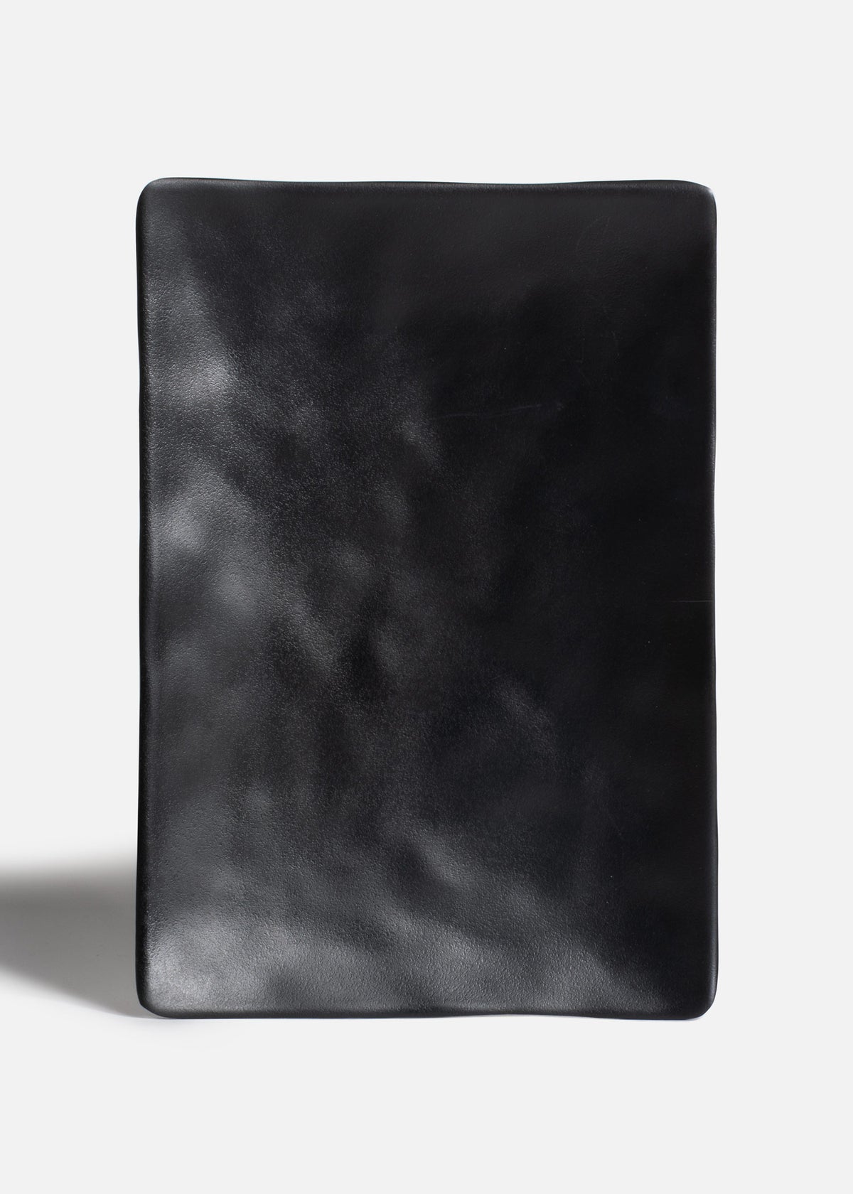 Plato rectangular de melamina negro mate con textura 25x17x2.4 cm — imagen de producto
