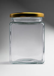 Frasco cuadrado de vidrio transparente con tapa de rosca dorada premium para miel mermeladas y productos gourmet 380 ml — imagen de producto