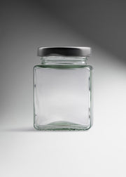 Frasco cuadrado de vidrio transparente con tapa de rosca plata premium para miel, especias y recuerdos 100 ml — imagen de producto