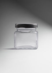 Frasco mini cuadrado de vidrio transparente con tapa de rosca plata premium para especias, recuerdos y productos gourmet 80 ml — imagen de producto