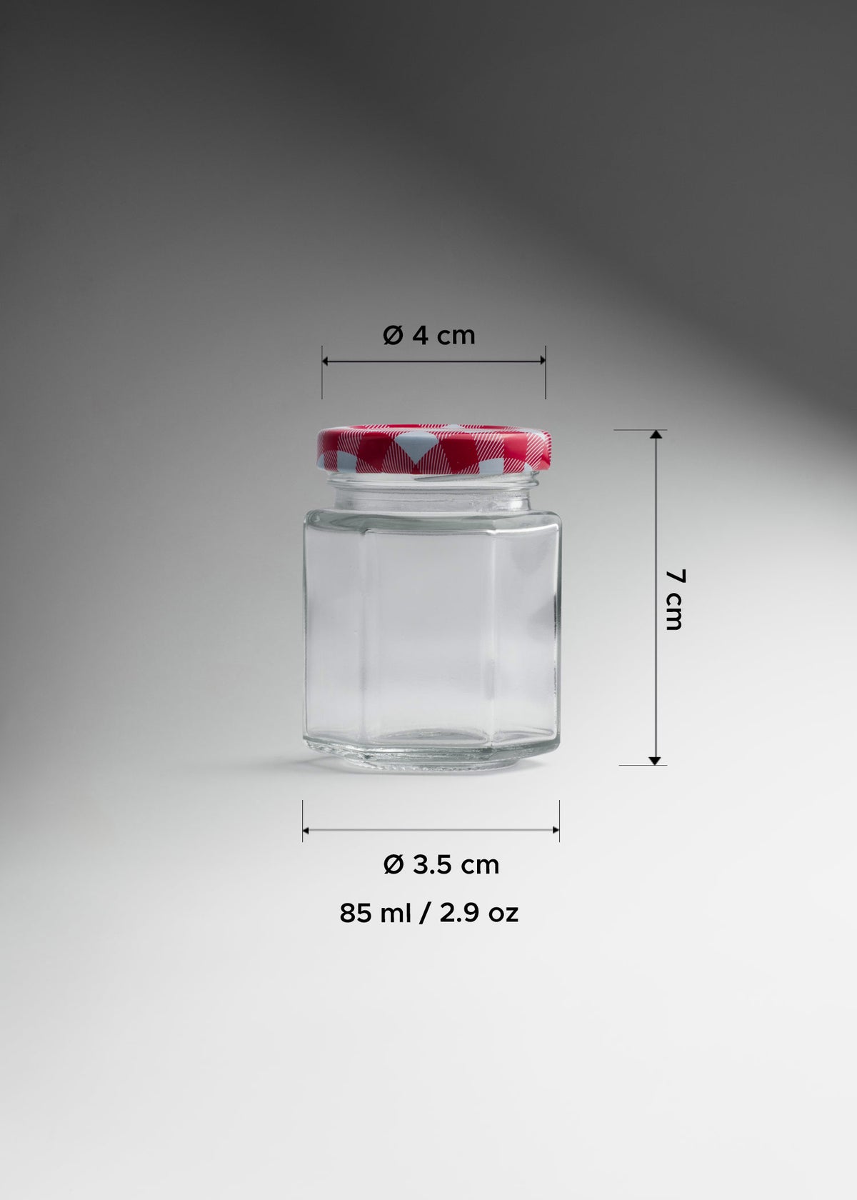 Frasco hexagonal de vidrio transparente con tapa roja uso alimenticio 85 ml — imagen de producto
