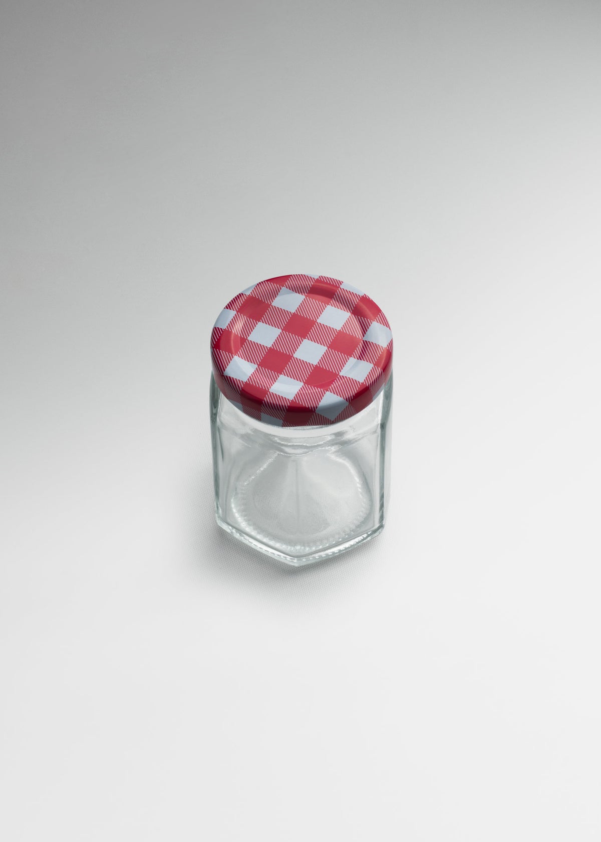 Frasco hexagonal de vidrio transparente con tapa roja uso alimenticio 85 ml — imagen de producto