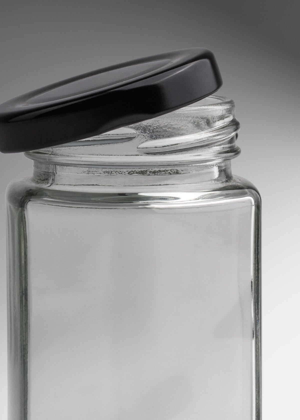 Frascos hexagonales de vidrio transparente con tapa negra uso alimenticio de 45 a 500 ml — imagen de producto