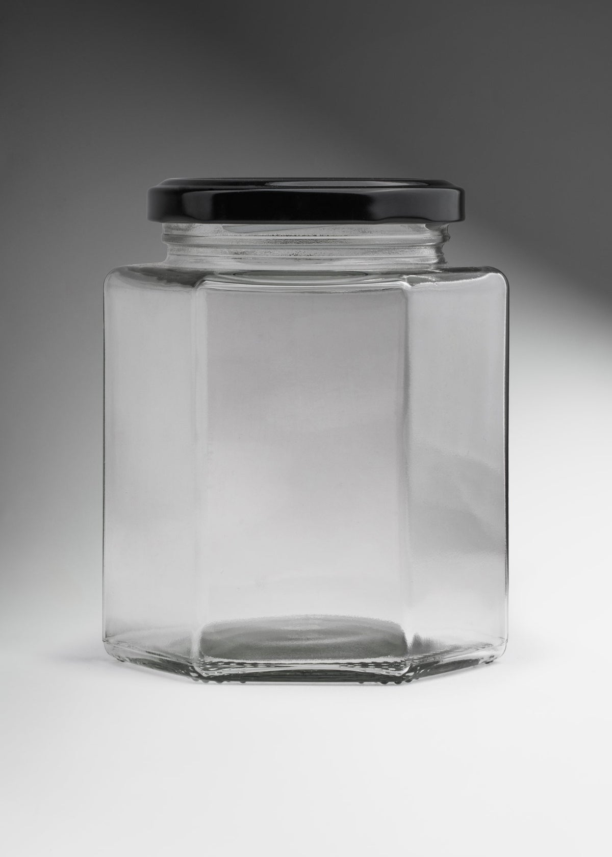 Frascos hexagonales de vidrio transparente con tapa negra uso alimenticio de 45 a 500 ml — imagen de producto