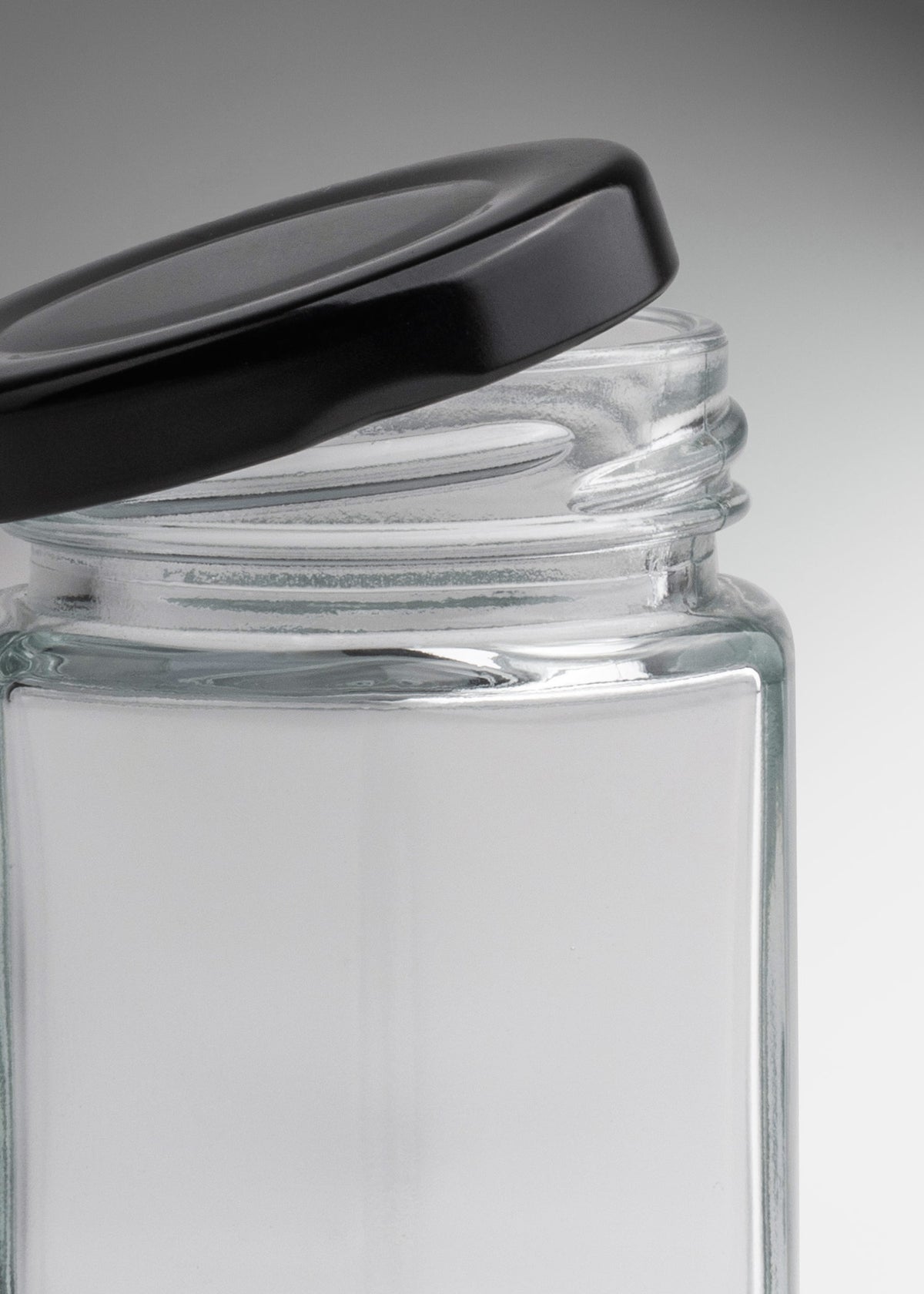 Frascos hexagonales de vidrio transparente con tapa negra uso alimenticio de 45 a 500 ml — imagen de producto