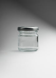 Frascos cilindro de vidrio transparente con tapa plateada de 50 a 500 ml — imagen de producto