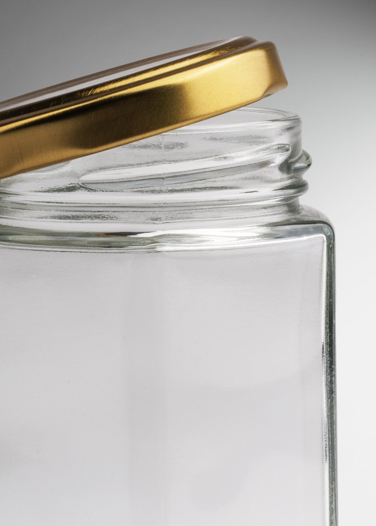 Frascos hexagonales de vidrio transparente con tapa dorada uso alimenticio de 45 a 500 ml — imagen de producto