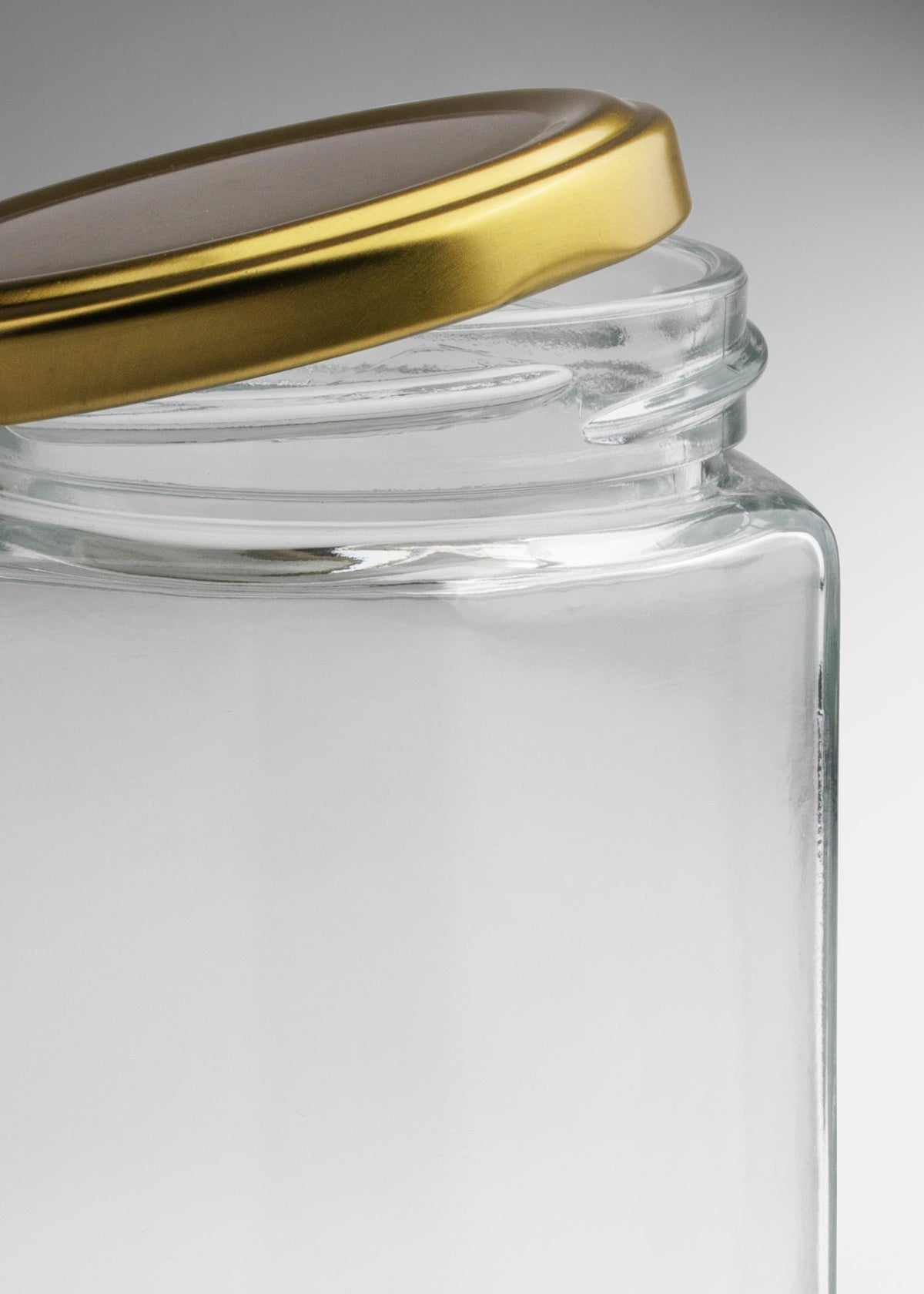 Frascos hexagonales de vidrio transparente con tapa dorada uso alimenticio de 45 a 500 ml — imagen de producto