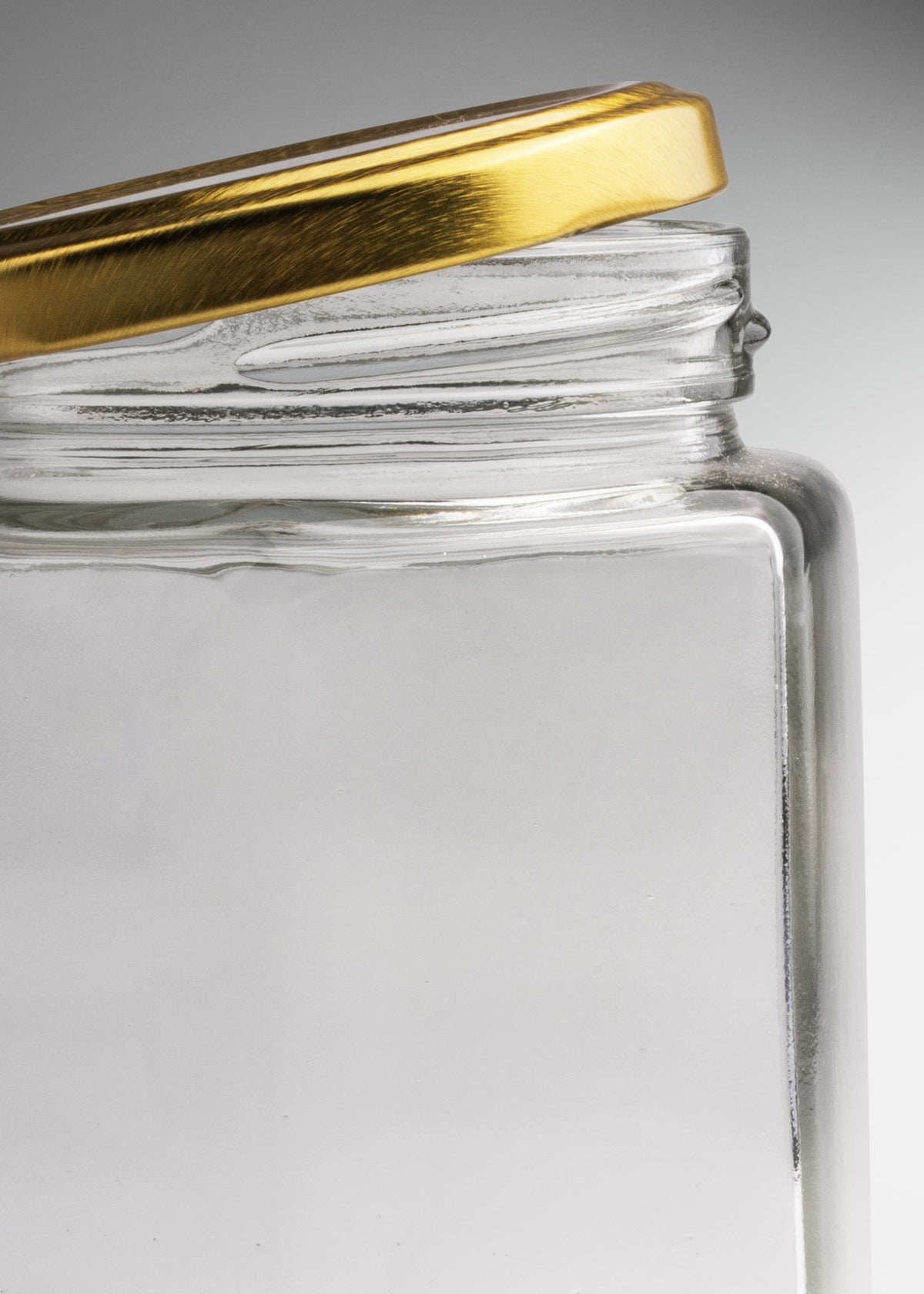 Frascos hexagonales de vidrio transparente con tapa dorada uso alimenticio de 45 a 500 ml — imagen de producto