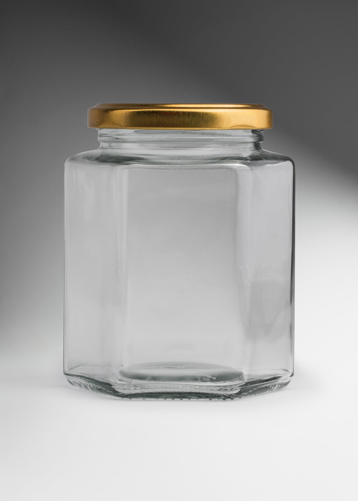 Frascos hexagonales de vidrio transparente con tapa dorada uso alimenticio de 45 a 500 ml — imagen de producto