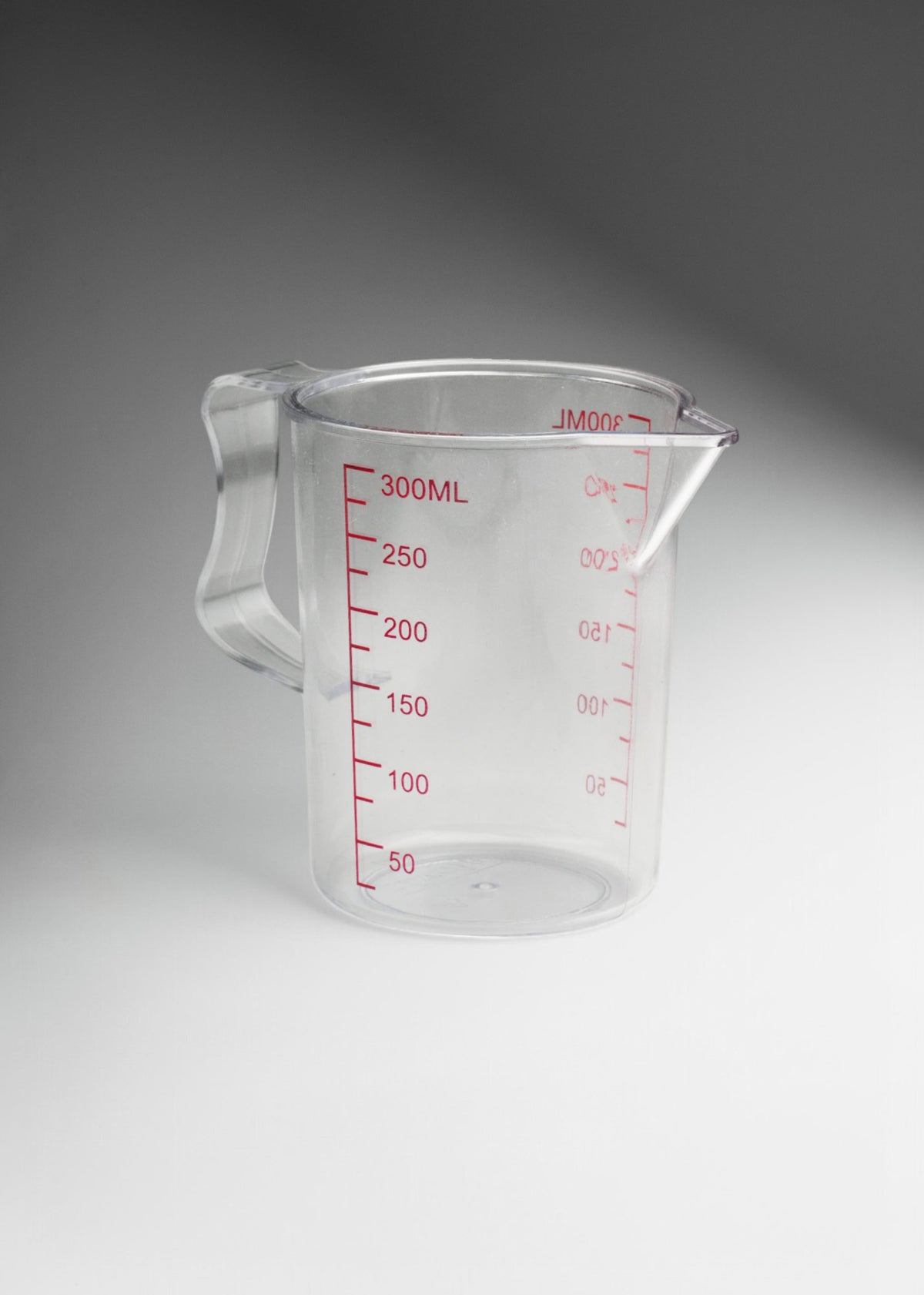 Jarra medidora de policarbonato transparente económica 300 ml — imagen de producto