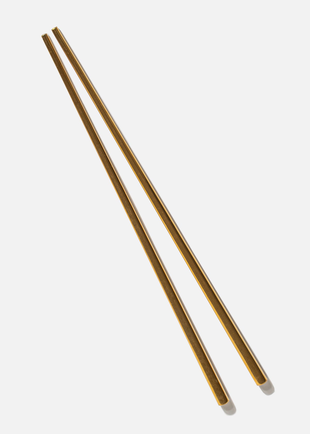 Par de palillos chinos de acero inoxidable electropintado dorado Aura — imagen de producto