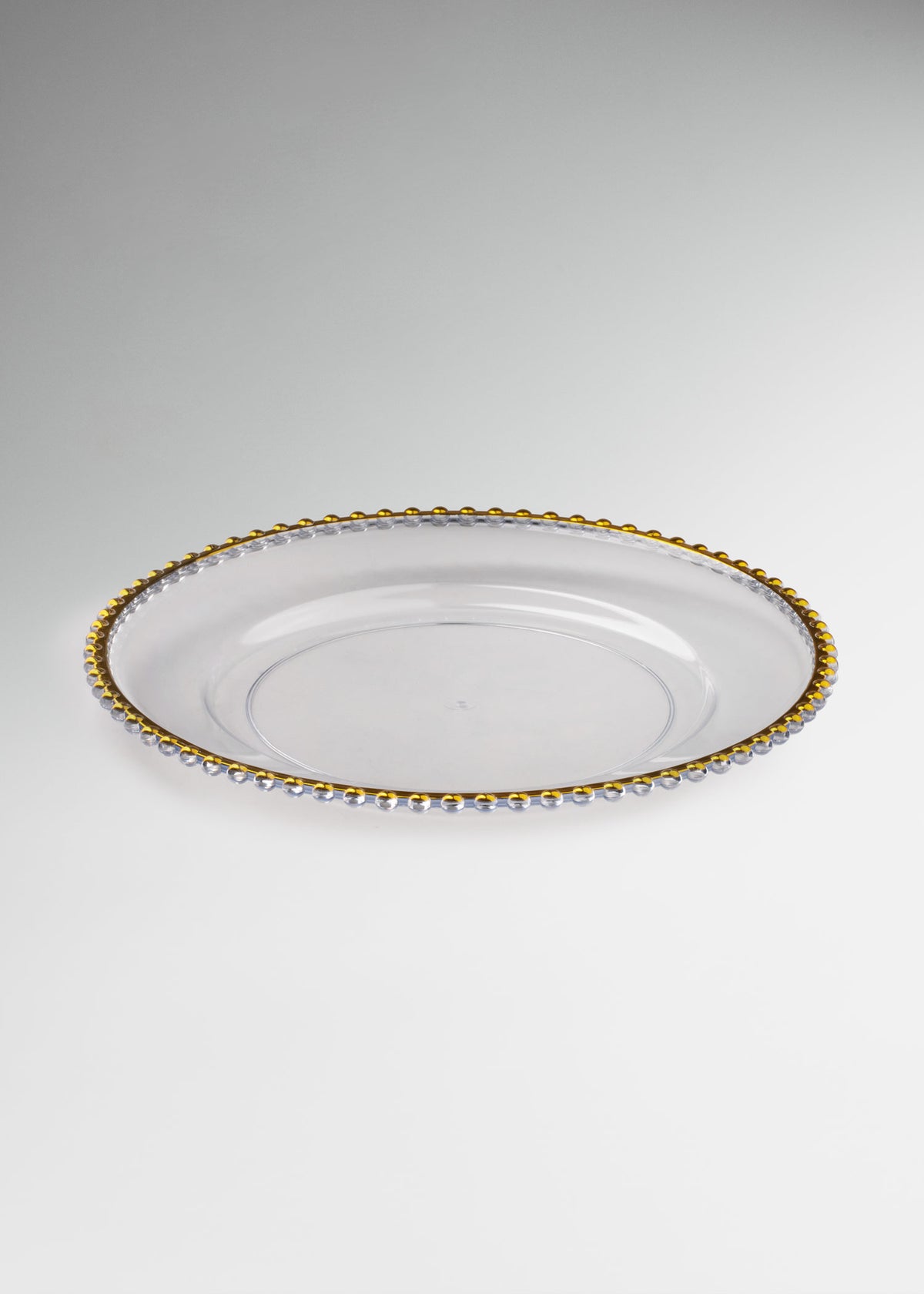 Uso profesional de Plato base de vidrio transparente con filo dorado Perla Ø 32 cm en banquetes, hoteles, restaurantes, bodas y eventos