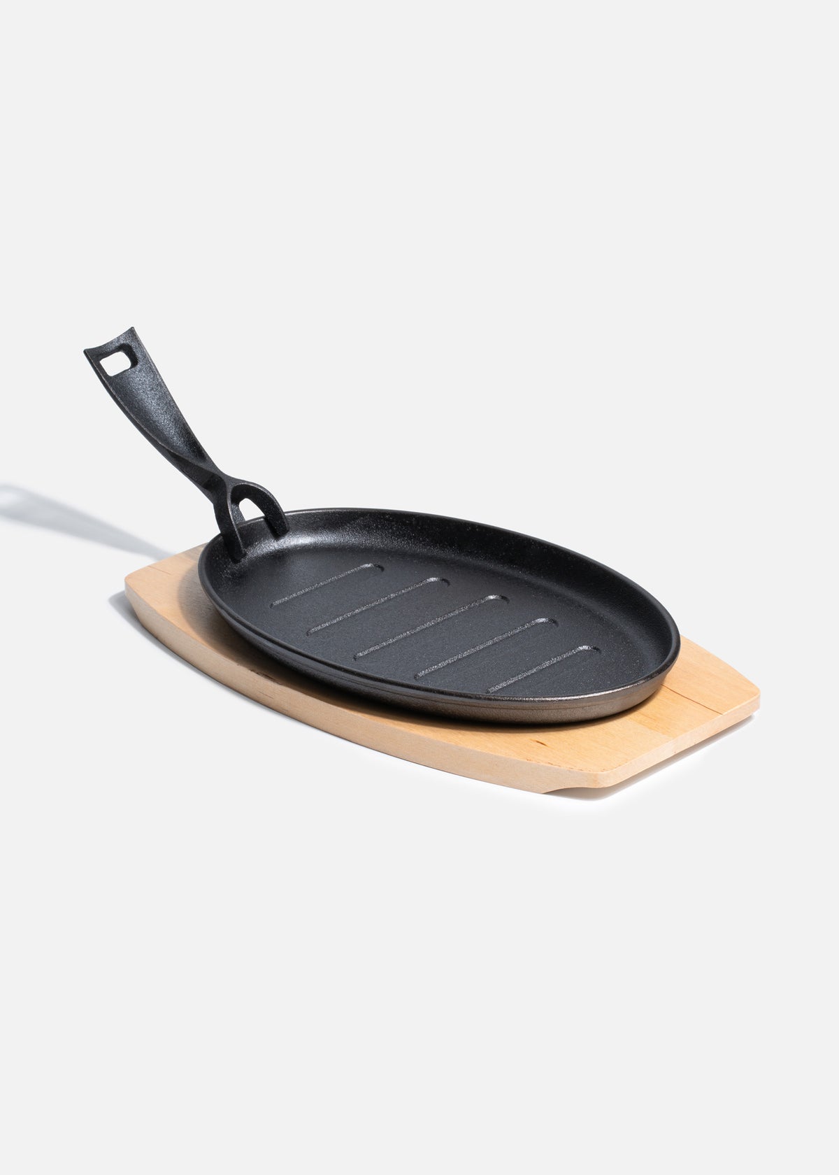 Sartén de hierro fundido oval negro con mango desmontable y base de madera 3.5x32x18 cm — imagen de producto