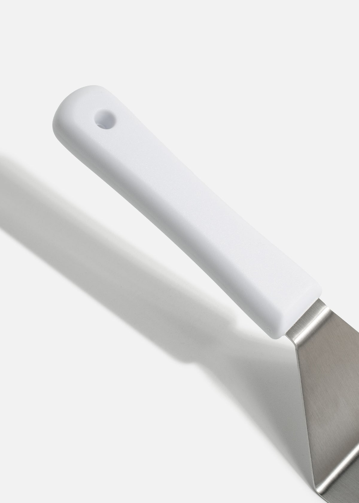 Volteador de cocina para pizza de acero inoxidable con mango de nylon blanco 8"x 3". Premium — imagen de producto