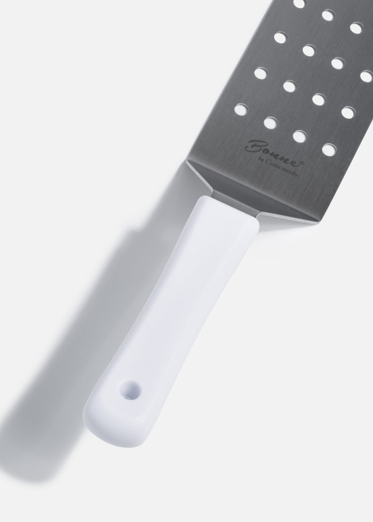 Volteador para pizza perforado de acero inoxidable plata y mango de nylon 25 cm — imagen de producto